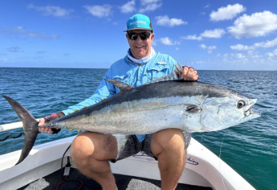steve holding a monster longtail - the biggest catch for hervey bay fly and sportfishing